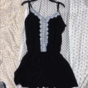 Black date night romper, white lace flower detail